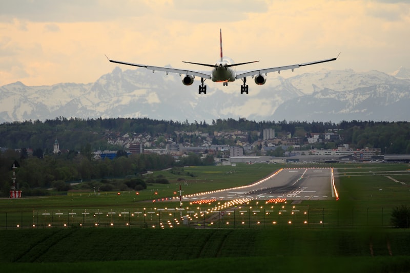 Plane landing at sunset — direct flights from North America to London